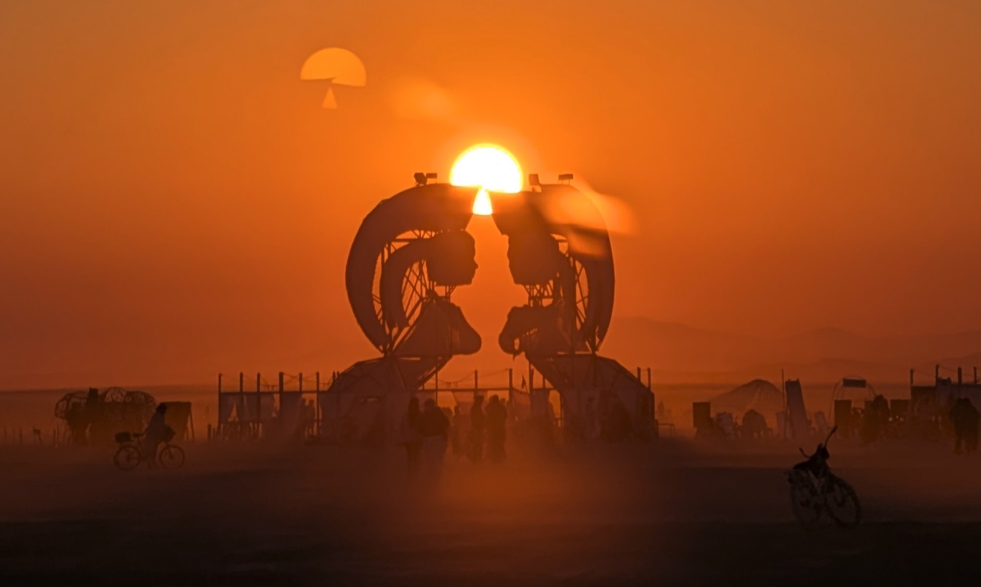 The two sphinxes silhouetted against the sunset, Burning Man 2025