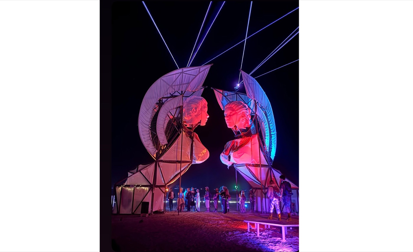 The Big Sphinxes lit at night with lasers, Burning Man 2025